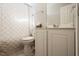 Cozy bathroom featuring a toilet, white vanity, and a shower with a patterned shower curtain at 401 Holly Thorn Trce, Holly Springs, NC 27540