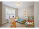 Bright, cute bedroom featuring whimsical decor and a playful color scheme at 401 Holly Thorn Trce, Holly Springs, NC 27540