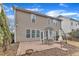 Back of house features a brick patio and beautiful backyard at 413 Westfalen Dr, Cary, NC 27519