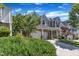 Beautiful two-story home with a landscaped yard, large windows, and a two-car garage at 413 Westfalen Dr, Cary, NC 27519