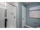 Contemporary bathroom features a glass enclosed shower with white subway tile on the walls at 414 Grange Farm Pl, Raleigh, NC 27603