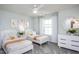 Bright bedroom with two twin beds, modern decor, and a ceiling fan with a window at 414 Grange Farm Pl, Raleigh, NC 27603
