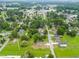 Aerial perspective highlighting the property's location within a residential area with mature trees and street access at 414 S Center St, Princeton, NC 27569