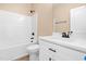 Bathroom with a shower-tub combo, vanity, and updated fixtures at 414 S Center St, Princeton, NC 27569