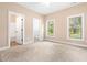 Spacious bedroom featuring natural light, plush carpeting, and ensuite access at 414 S Center St, Princeton, NC 27569