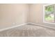 Corner bedroom featuring plush carpeting, and large windows at 414 S Center St, Princeton, NC 27569