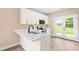 Bright kitchen featuring quartz countertops and stainless appliances at 414 S Center St, Princeton, NC 27569