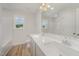 Clean bathroom featuring a double sink vanity and a large mirror at 44 Chloe Ct, Selma, NC 27576