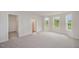 Spacious bedroom with carpet and many windows for natural light at 44 Chloe Ct, Selma, NC 27576