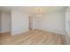 Light-filled dining area with modern light fixture and neutral walls, ready for personalization at 44 Chloe Ct, Selma, NC 27576