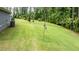 Spacious backyard with manicured lawn, ideal for outdoor gatherings and enjoying nature at 440 Bramble Ln, Clayton, NC 27527