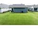Expansive backyard with lush green grass, providing ample space for outdoor activities and relaxation at 440 Bramble Ln, Clayton, NC 27527
