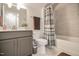 Modern bathroom features a sleek vanity, neutral gray tones, tiled shower, and updated fixtures at 440 Bramble Ln, Clayton, NC 27527