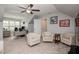 A spacious bonus room features a ceiling fan, ample seating, and a desk area at 440 Bramble Ln, Clayton, NC 27527