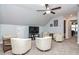 Bright bonus room with neutral walls, recessed lighting and four chairs at 440 Bramble Ln, Clayton, NC 27527