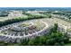 Aerial view of the residential community surrounded by lush greenery, showcasing a peaceful neighborhood setting at 440 Bramble Ln, Clayton, NC 27527