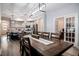 Open-concept dining area seamlessly connects to a modern kitchen, creating an ideal space for entertaining and Gathering gatherings at 440 Bramble Ln, Clayton, NC 27527
