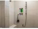 A modern tiled shower with built-in shelving and a rainfall showerhead at 440 Bramble Ln, Clayton, NC 27527