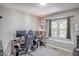 A home office with great lighting, two computer setups, and nice decor at 460 Dickens Dr, Raleigh, NC 27610