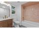 Charming bathroom featuring unique tile work, a modern vanity, and a shower-tub combo at 4812 Latimer Rd, Raleigh, NC 27609