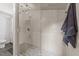Contemporary bathroom featuring shower with glass partition, gray tiling, modern fixtures, and stylish lighting at 4812 Latimer Rd, Raleigh, NC 27609