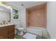Updated bathroom features a unique tiled shower, modern vanity, and a bright window at 4812 Latimer Rd, Raleigh, NC 27609