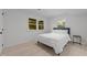 Bright bedroom with large windows, neutral decor, and a comfortable queen-sized bed at 4812 Latimer Rd, Raleigh, NC 27609