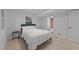 Cozy bedroom with a soft queen-sized bed, natural light, and an adjoining bathroom at 4812 Latimer Rd, Raleigh, NC 27609