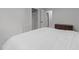 Neutral bedroom with a queen-sized bed, closet, dresser, and bright natural light at 4812 Latimer Rd, Raleigh, NC 27609