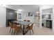 Elegant dining room featuring a modern fireplace, a dining table with chairs, and recessed lighting at 4812 Latimer Rd, Raleigh, NC 27609