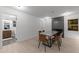 Elegant dining room with a modern fireplace and views into a nearby bathroom at 4812 Latimer Rd, Raleigh, NC 27609