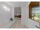 Stylish entryway with decorative walls, stairs, and view into the living room at 4812 Latimer Rd, Raleigh, NC 27609