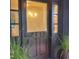 Elegant dark front door with glass panes and decorative house numbers at 4812 Latimer Rd, Raleigh, NC 27609