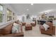 Spacious open-concept living room with leather seating and views into the kitchen and staircase at 4812 Latimer Rd, Raleigh, NC 27609