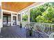 Comfortable screened porch with dark floors, seating area, and a view of the backyard at 508 N Wake St, Hillsborough, NC 27278