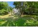A beautiful backyard featuring a fenced garden and a spacious lawn at 508 N Wake St, Hillsborough, NC 27278