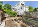Backyard featuring garden beds, a staircase and a porch with green shrubs at 508 N Wake St, Hillsborough, NC 27278