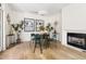 Cozy dining area features a fireplace, hardwood floors, and stylish decor at 508 N Wake St, Hillsborough, NC 27278