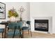 A corner dining area is enhanced by a stylish fireplace, decor and natural light at 508 N Wake St, Hillsborough, NC 27278