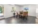 Charming dining area features a stylish table, woven chairs, and a plant near the window offering natural light at 508 N Wake St, Hillsborough, NC 27278