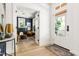 Bright entryway with hardwood floors, a view of the living room, and natural light at 508 N Wake St, Hillsborough, NC 27278