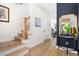 Welcoming entryway with hardwood floors, staircase, and stylish decor at 508 N Wake St, Hillsborough, NC 27278