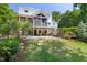 Expansive backyard with multiple decks, including a screened porch perfect for relaxing and entertaining at 508 N Wake St, Hillsborough, NC 27278