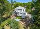 An aerial view showcases this charming two-story home featuring a screened porch and spacious backyard with a garden at 508 N Wake St, Hillsborough, NC 27278