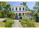 Charming two-story home with a welcoming front porch, garden pathway, and lush greenery at 508 N Wake St, Hillsborough, NC 27278