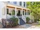 Inviting front porch with a porch swing and stylish black-framed windows at 508 N Wake St, Hillsborough, NC 27278