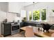 Modern kitchen featuring a stainless steel range and a large window with a wooded view at 508 N Wake St, Hillsborough, NC 27278