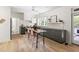 Bright kitchen with stainless steel appliances, a center island, and a view of the backyard at 508 N Wake St, Hillsborough, NC 27278