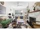 Cozy living room with a fireplace, stylish decor, and bright, natural lighting at 508 N Wake St, Hillsborough, NC 27278