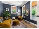 Stylish living room with dark walls, ample windows, and comfortable seating at 508 N Wake St, Hillsborough, NC 27278